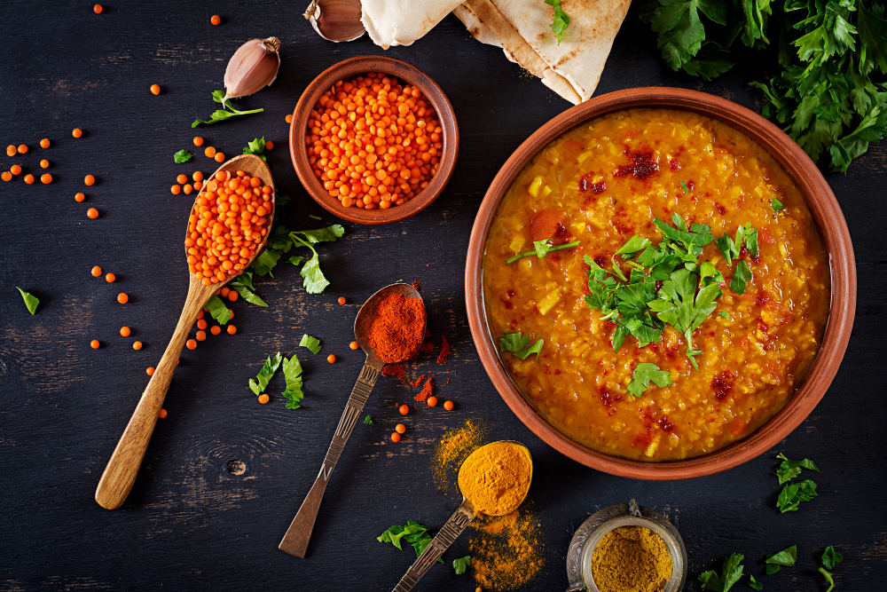 traditional-indian-soup-lentils-indian-dhal-spicy-curry-bowl-spices-herbs-rustic-black-wooden-table (1)